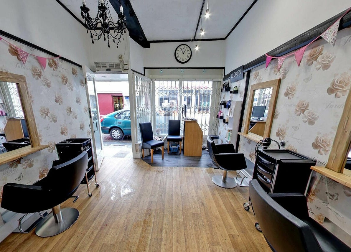 Studio 26's elegant beauty salon in Royston, England with chic décor and comfortable seating.