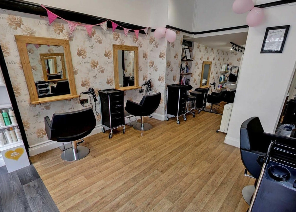 Elegant salon space at Studio 26 featuring chic chairs and stylish decor in Royston, England, GB.