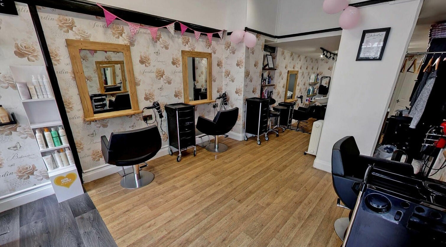 Elegant salon space at Studio 26 featuring chic chairs and stylish decor in Royston, England, GB.