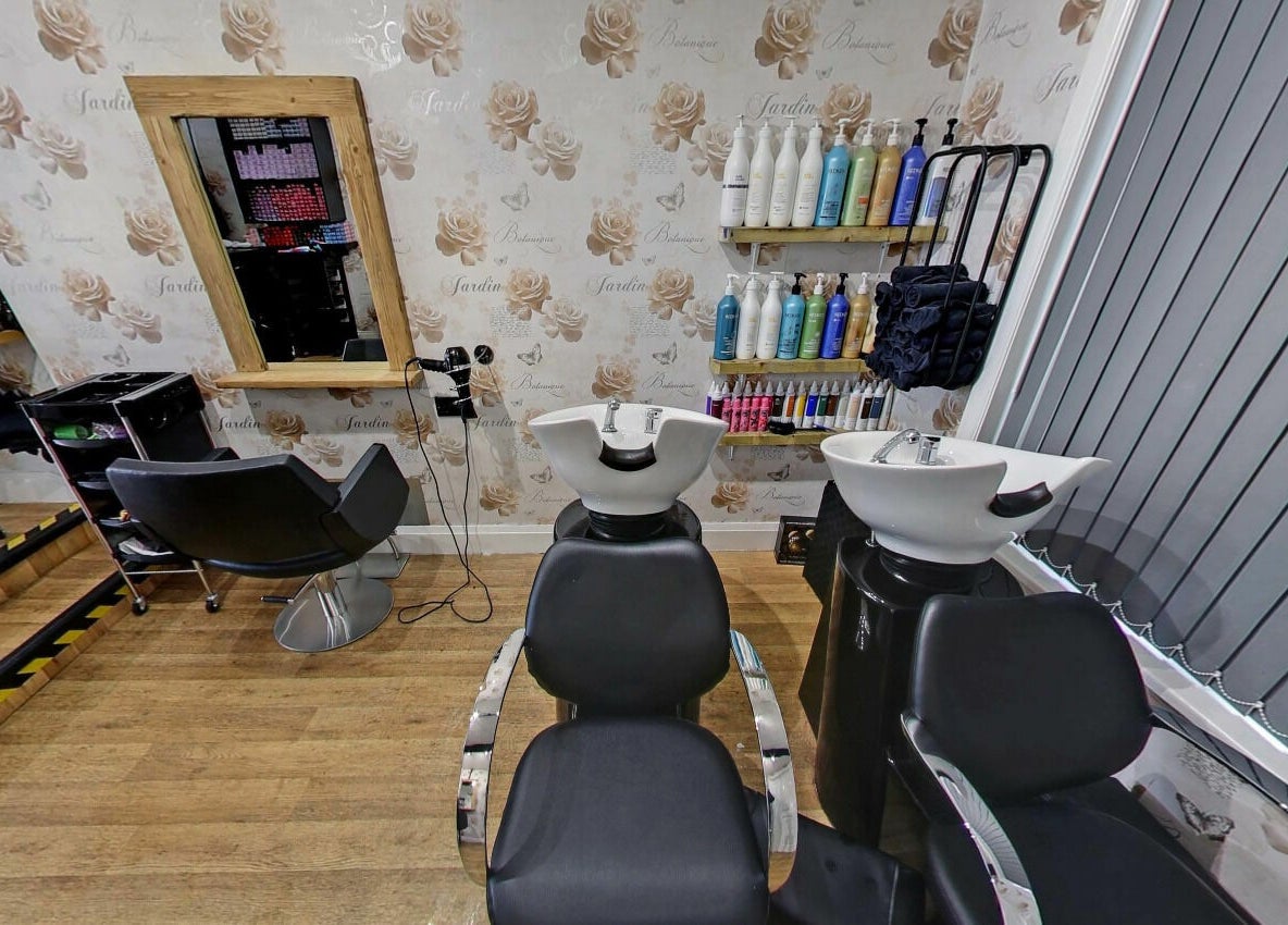 Chic hair washing and styling stations at Studio 26 in Royston, England, GB with elegant decor.