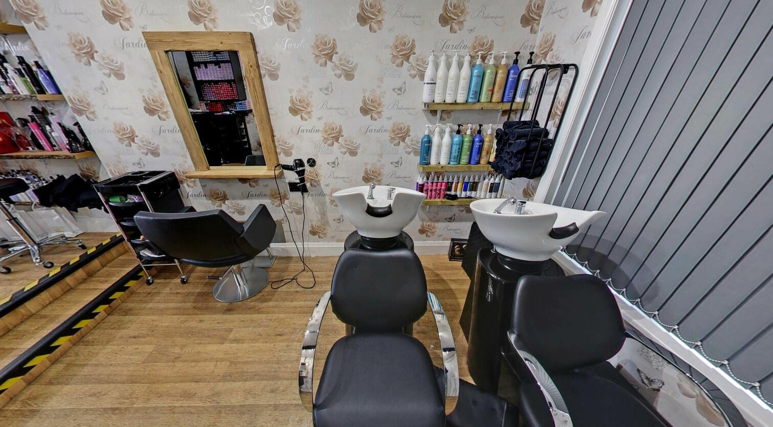 Chic hair washing and styling stations at Studio 26 in Royston, England, GB with elegant decor.