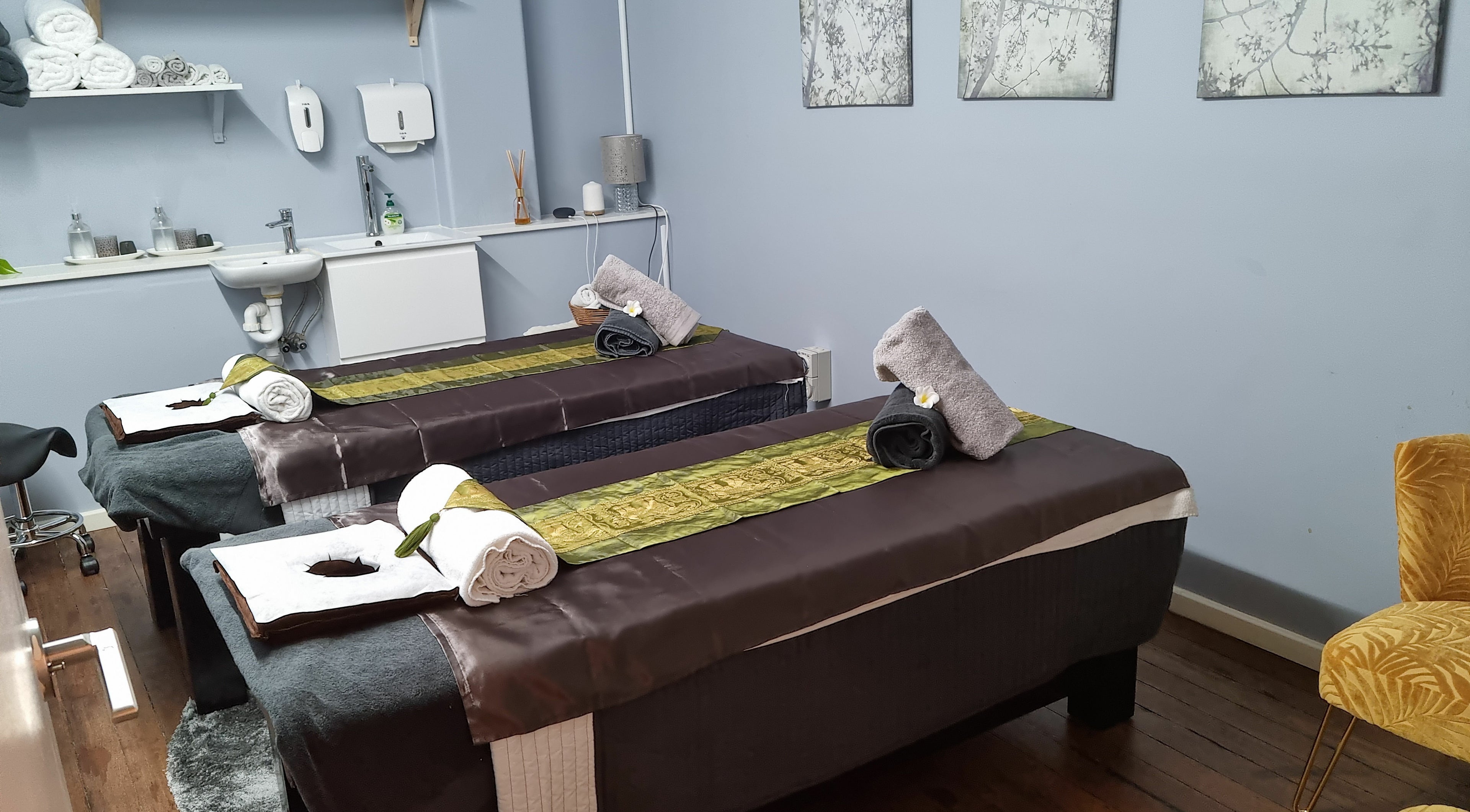 Serene massage room at Infinity Beauty, Laser & Massage in Sydney, New South Wales, AU with two treatment beds.