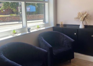 Relaxing seating area at Lauren Giorgia’s House Of Beauty, Measham, England, GB with elegant decor.