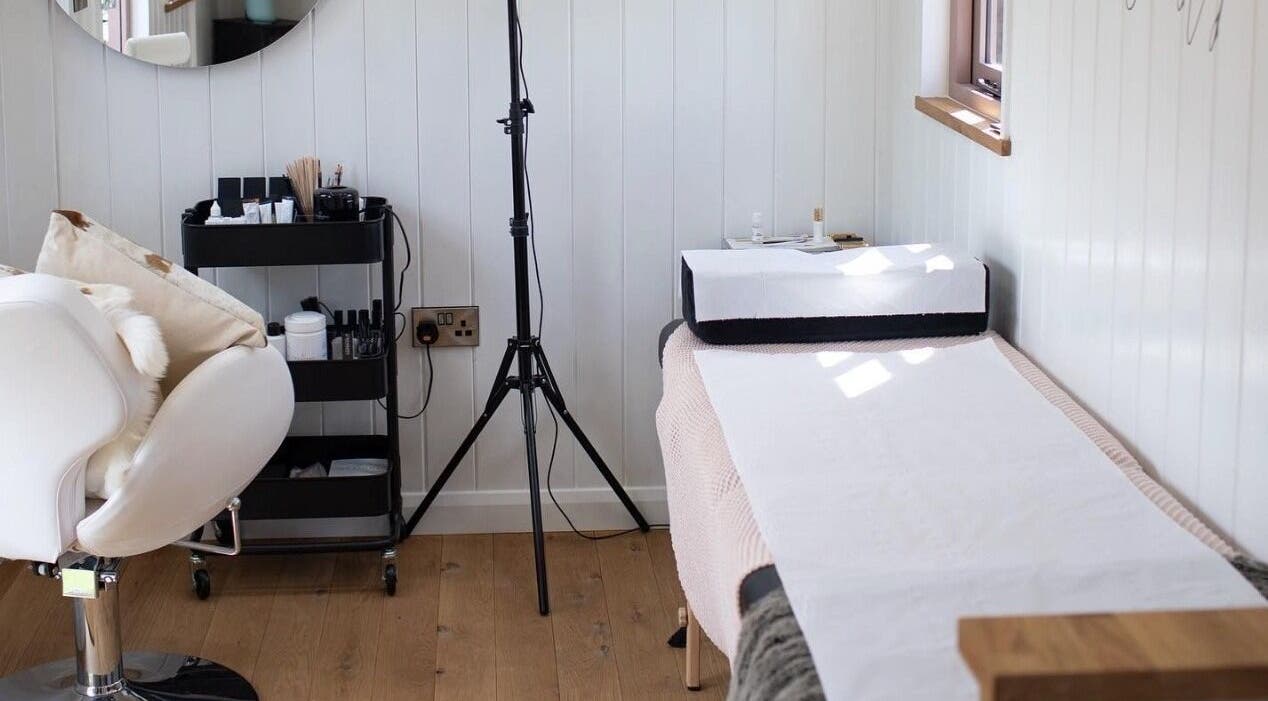 Cozy treatment area at Htj_Beauty, Eccelshall, England, GB, featuring a relaxing massage bed and elegant decor.