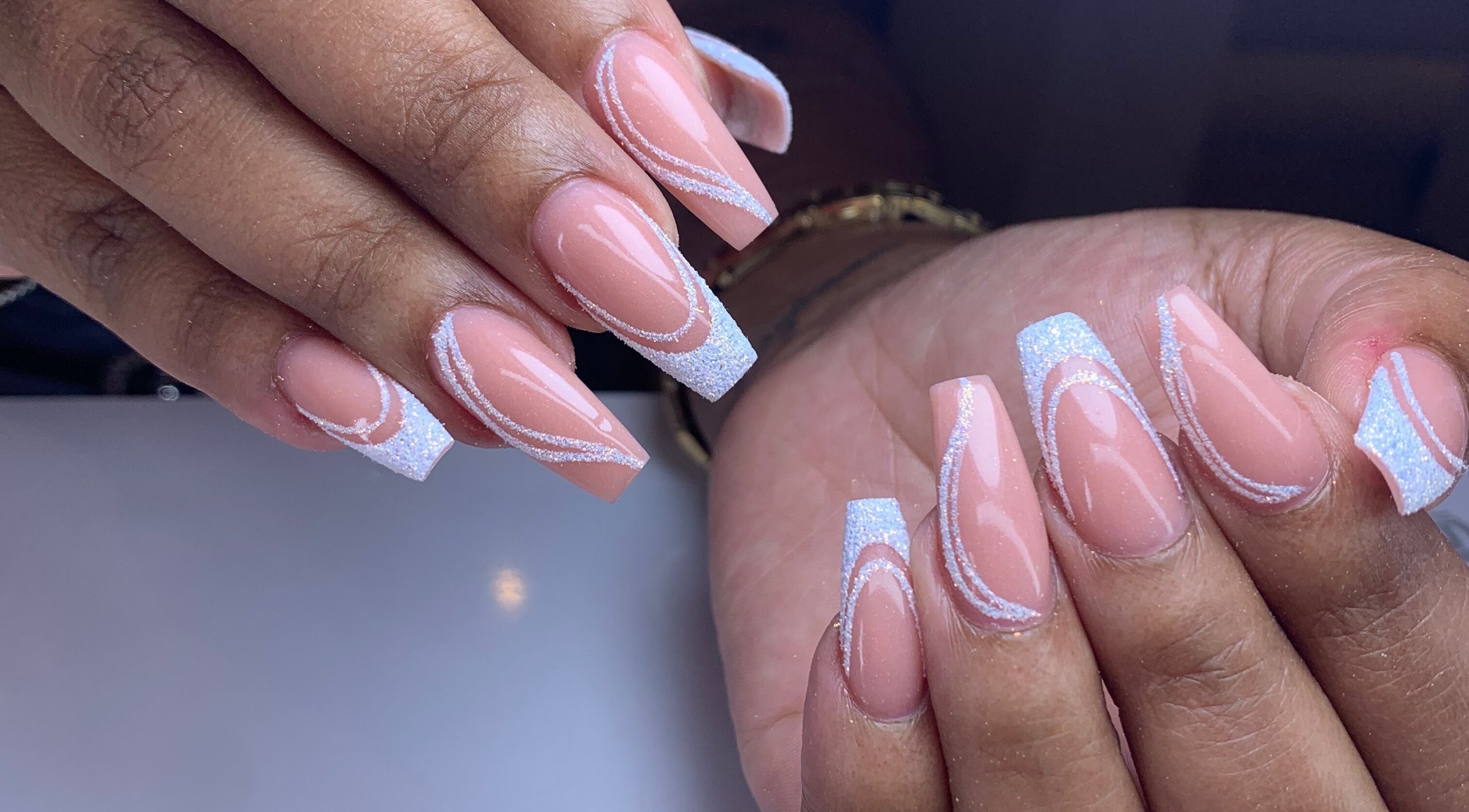 Detailed nail art at Sandra Style and Art Gosieweg, Willemstad, Curaçao, CW featuring glitter and swirl designs.