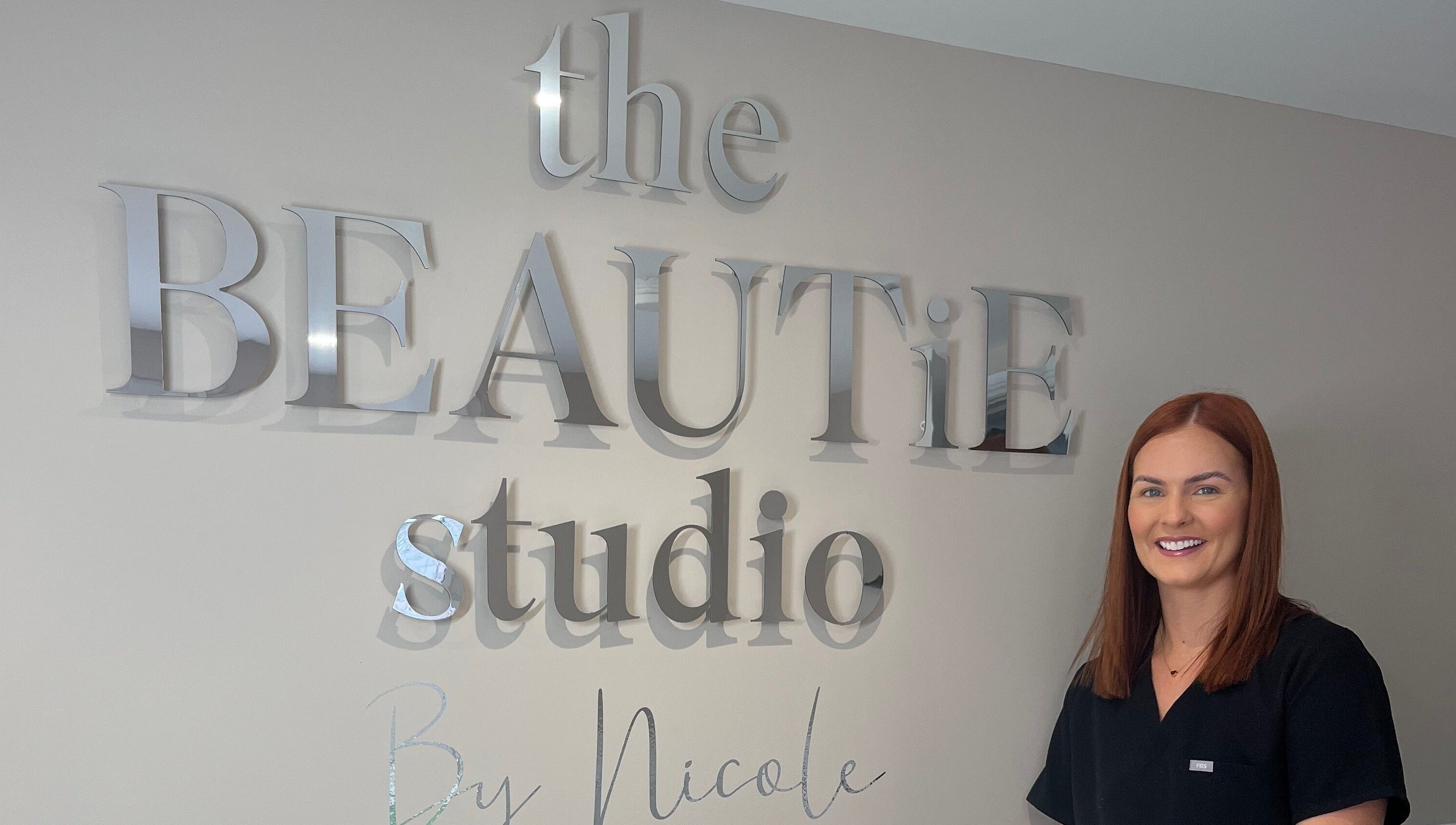 Welcome to The Beautie Studio in Londonderry, Northern Ireland, GB, featuring elegant signage and friendly staff.
