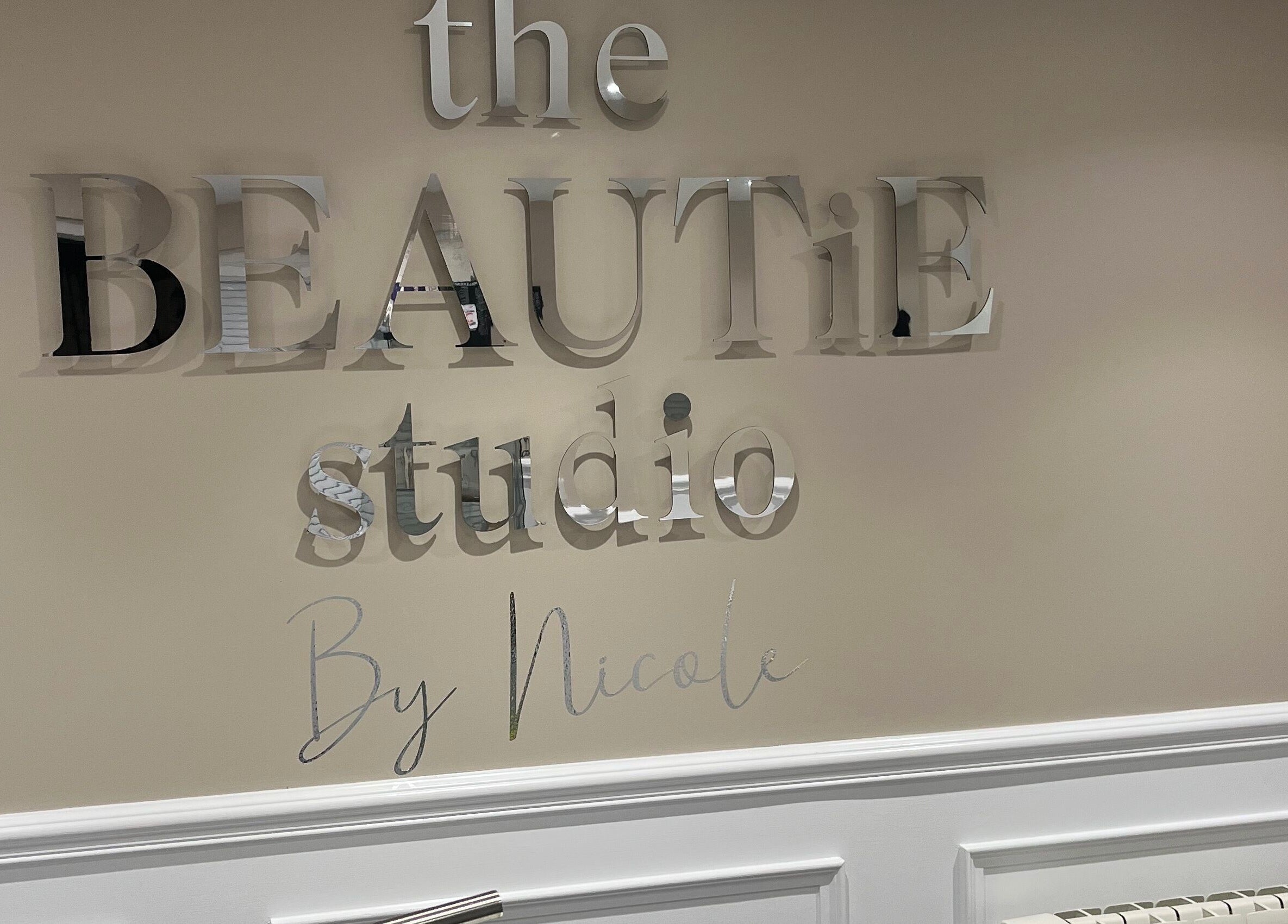 The Beautie Studio's elegant wall sign in Londonderry, Northern Ireland, GB.
