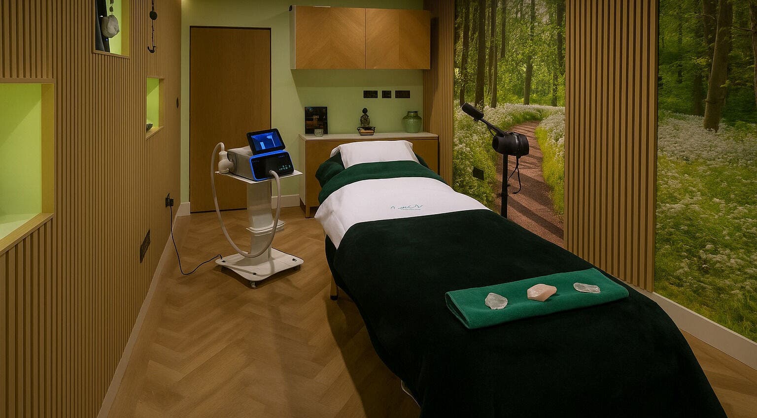 Tranquil therapy room at Essence Therapy and Healing Clinic, Redhill, England, GB with soft lighting and massage bed.