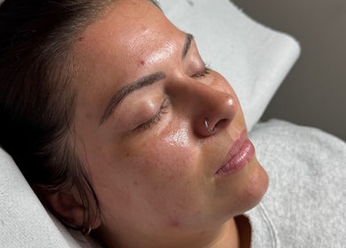 Client with radiant skin enjoying relaxation at Lovetolashx, Rubery, England, GB.