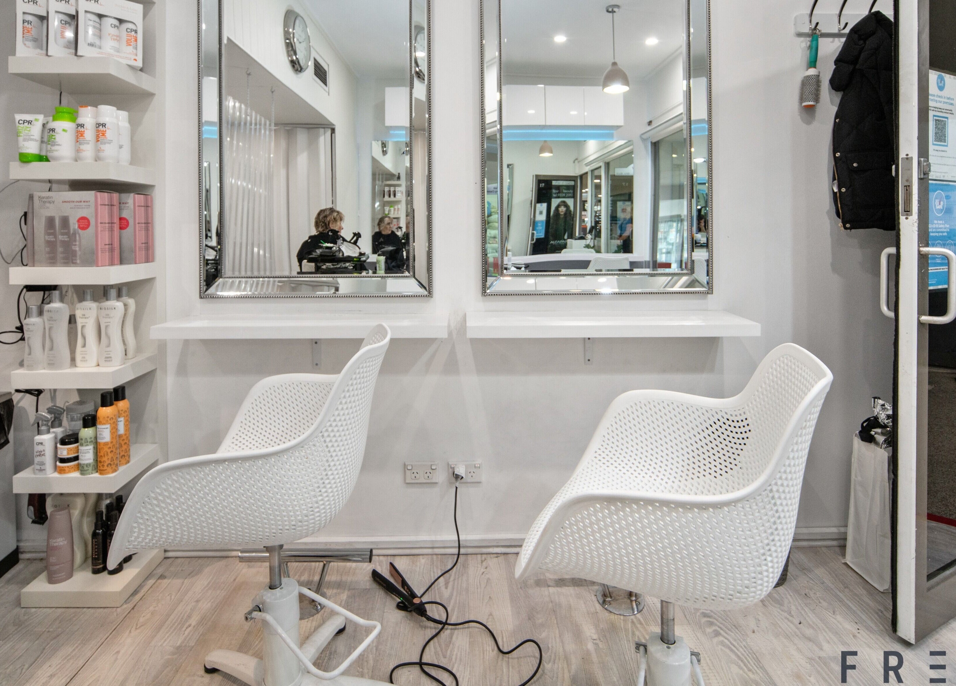 Modern salon chairs and mirrors at Rafael Salon - Double Bay, located in Double Bay, New South Wales, AU.