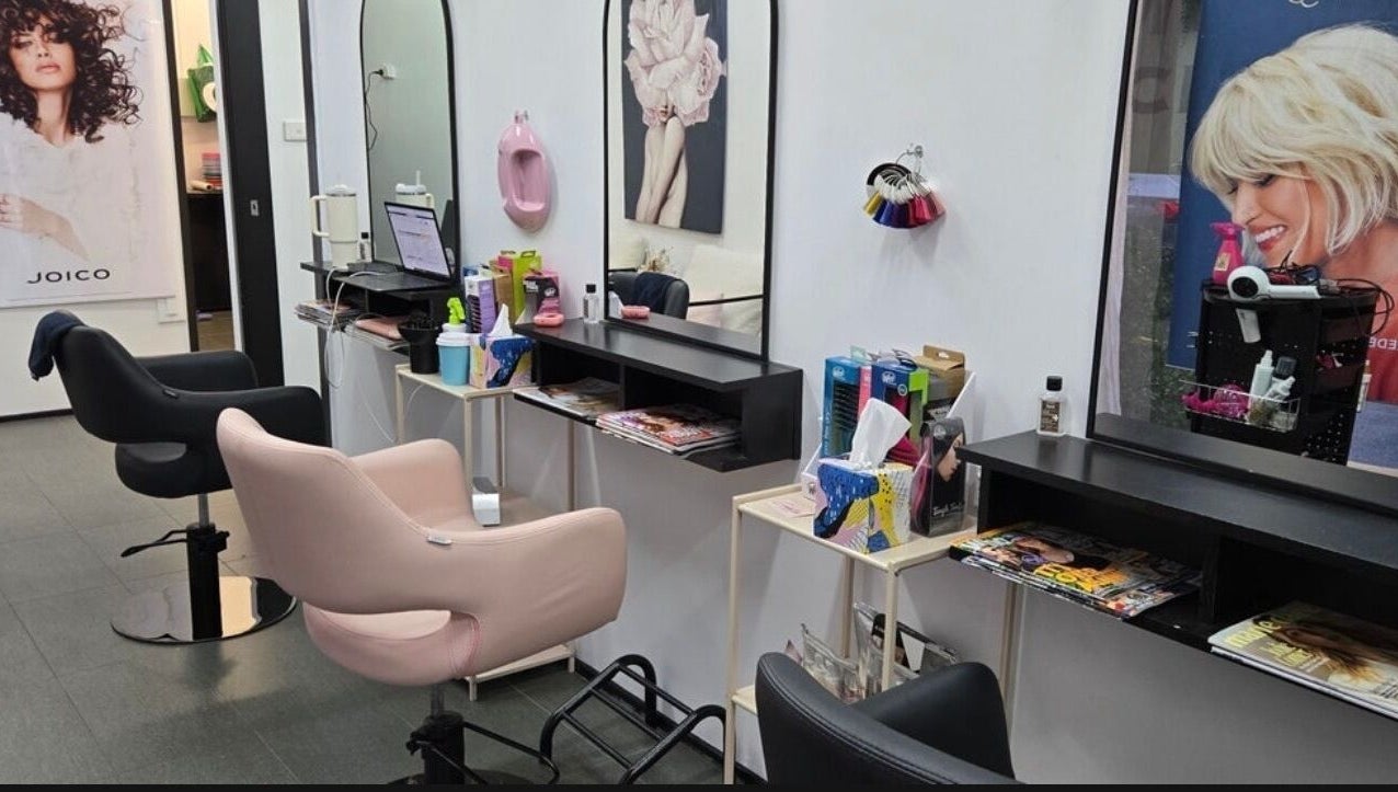 Modern salon interior with stylish chairs at Create Hair & Co, Corrimal, New South Wales, AU.