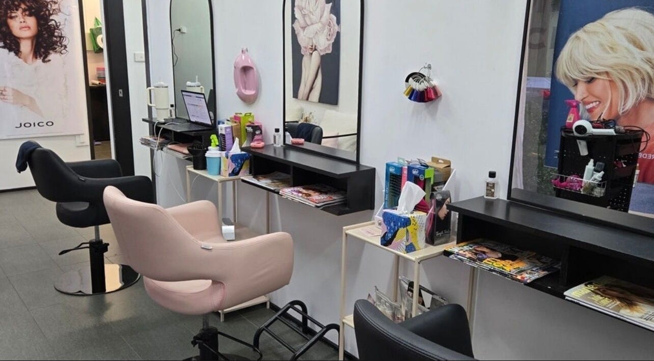 Modern salon interior with stylish chairs at Create Hair & Co, Corrimal, New South Wales, AU.