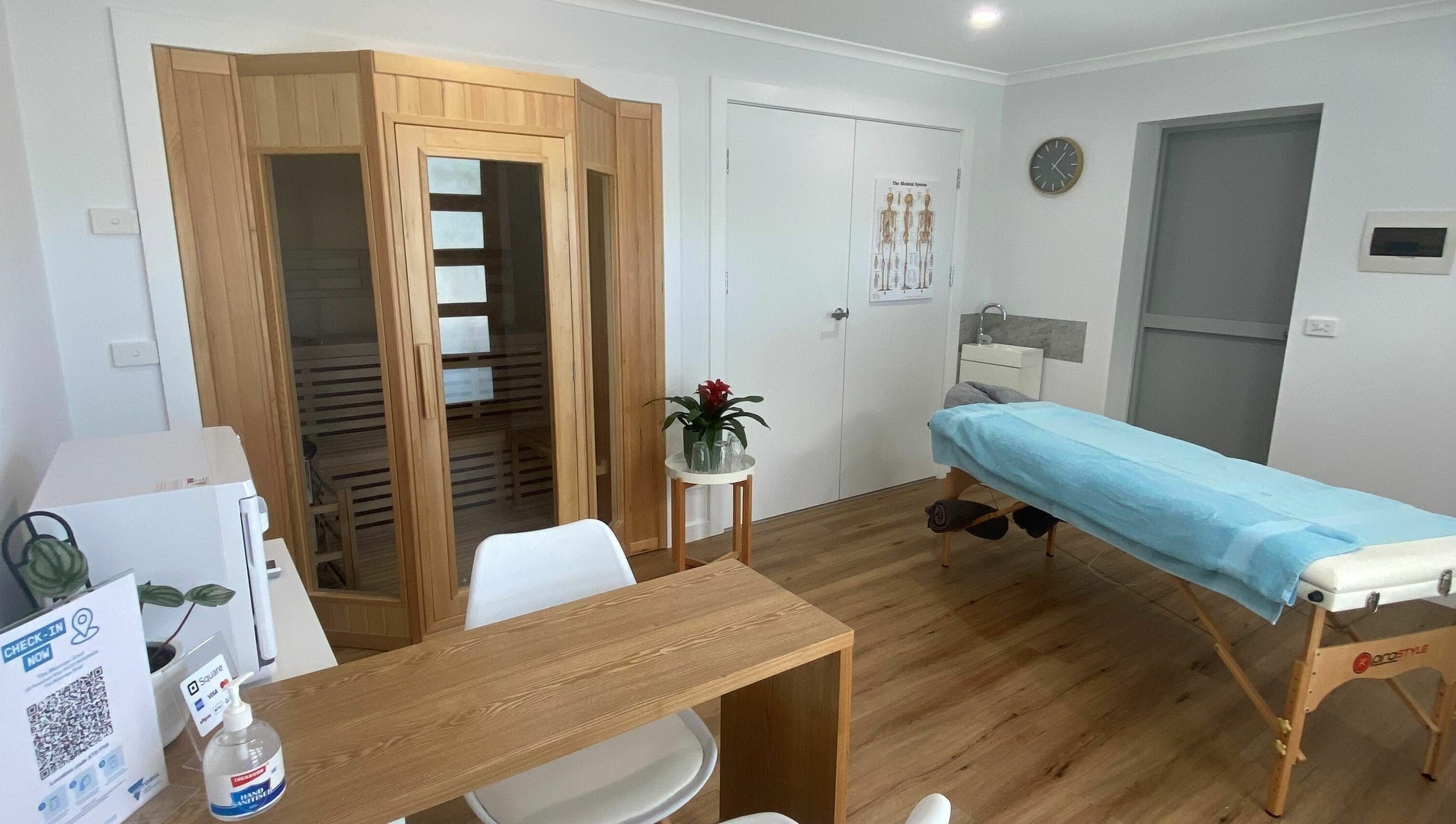 Relaxing massage room at The Massage Shed, Wodonga, Victoria, AU with table and sauna.