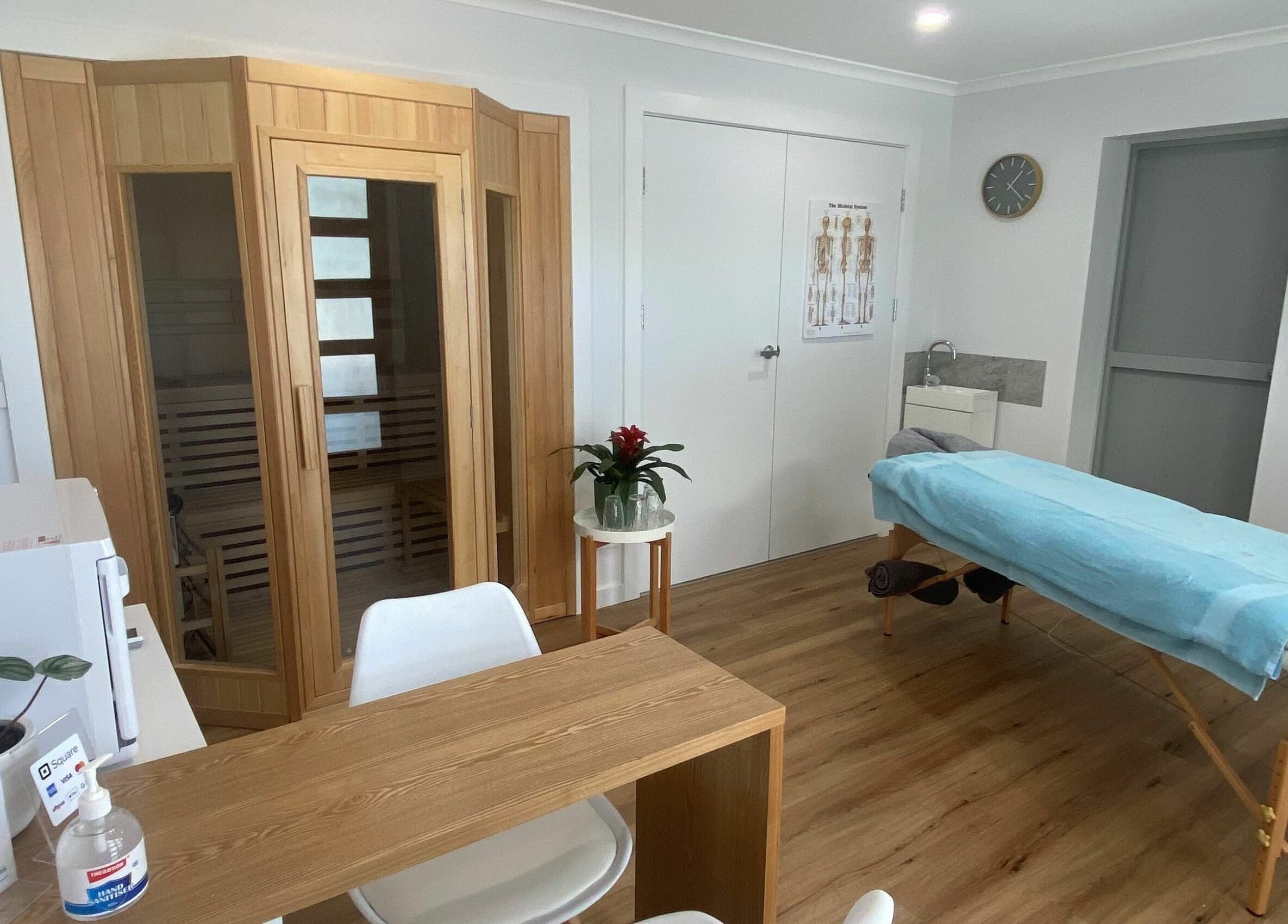 Relaxing massage room at The Massage Shed, Wodonga, Victoria, AU with table and sauna.