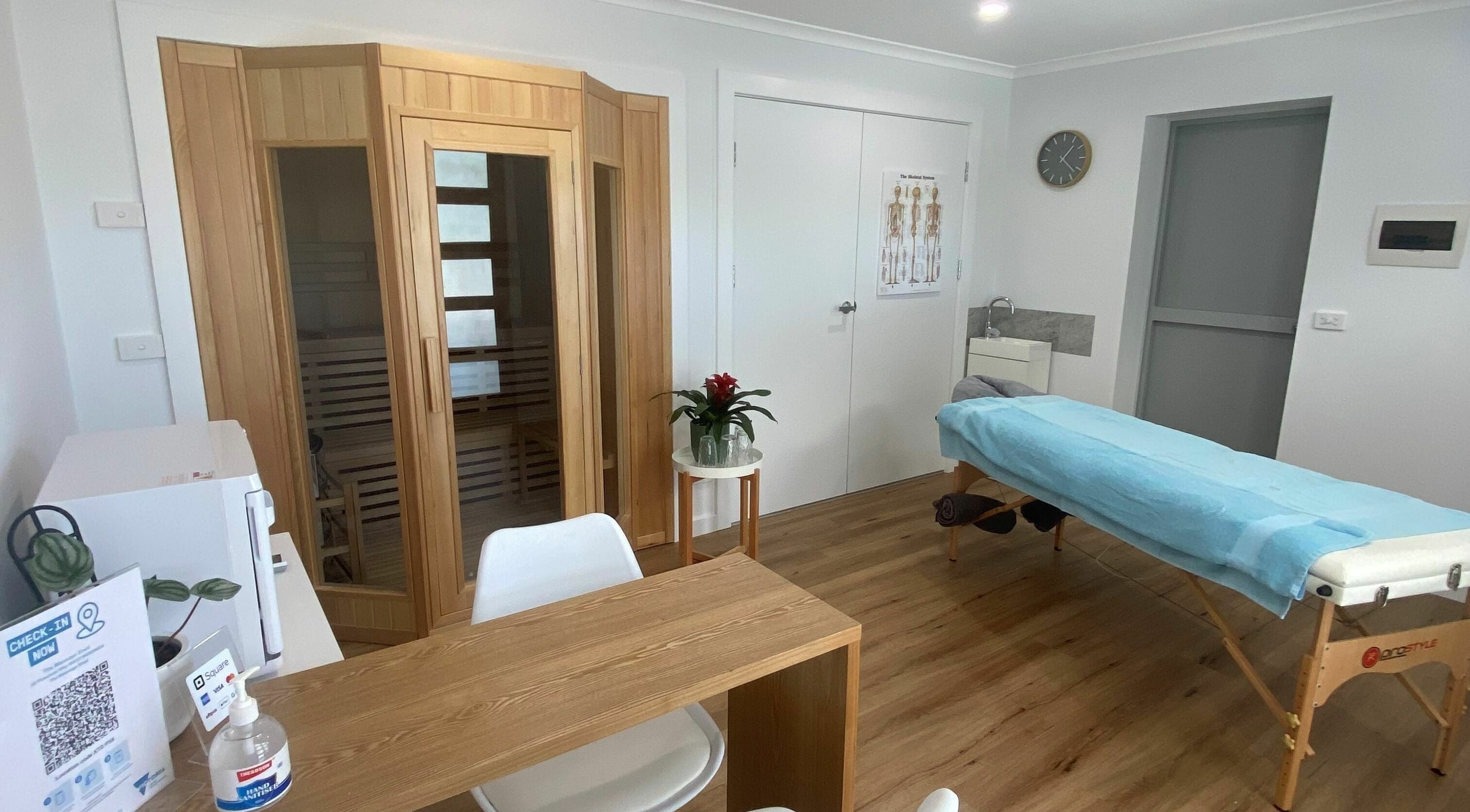 Relaxing massage room at The Massage Shed, Wodonga, Victoria, AU with table and sauna.