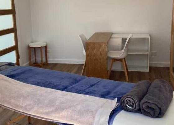 Calming massage room at The Massage Shed, Wodonga, Victoria, AU, featuring a neatly arranged massage table.