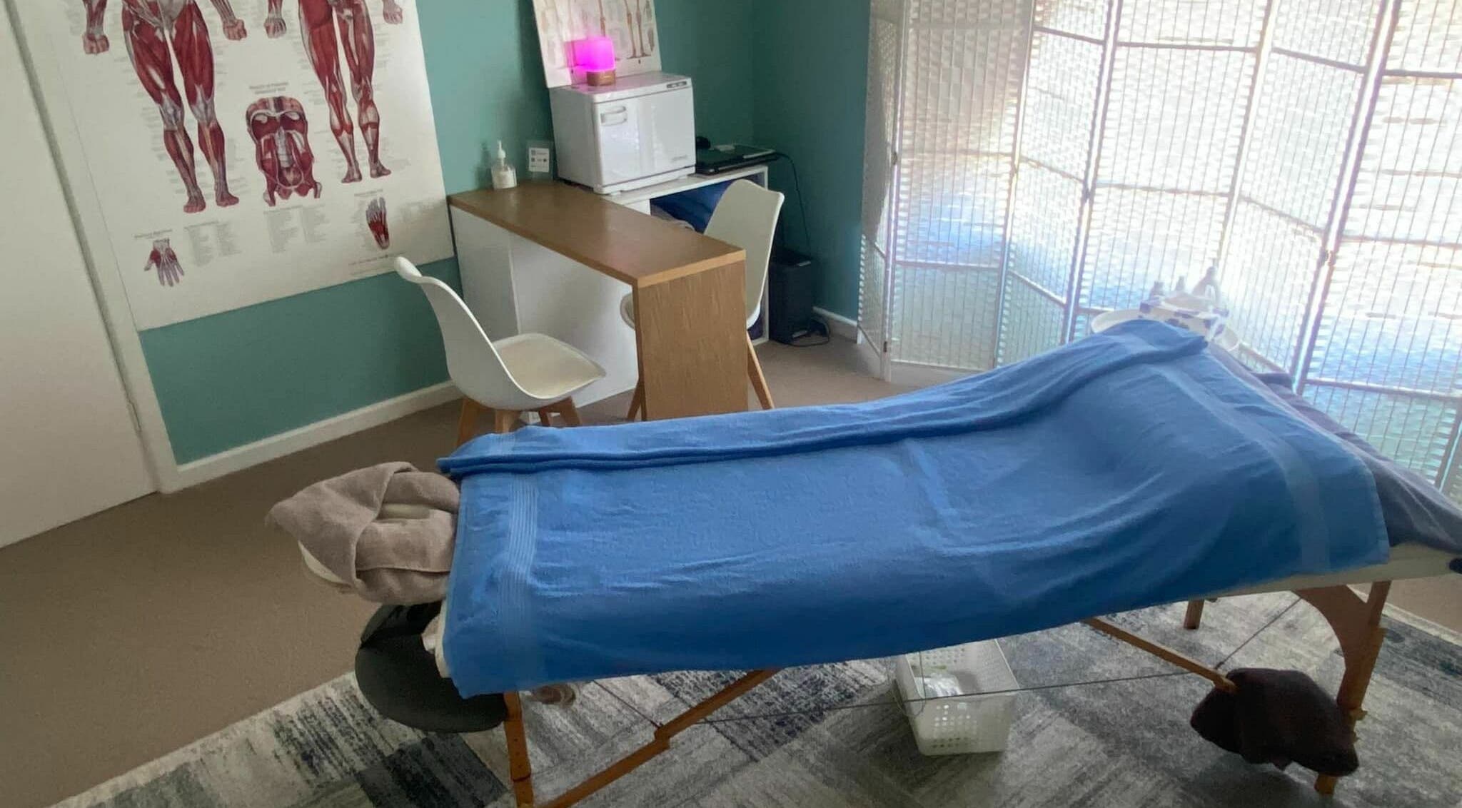 Cozy massage room at The Massage Shed, Wodonga, Victoria, AU with treatment table and calming decor.