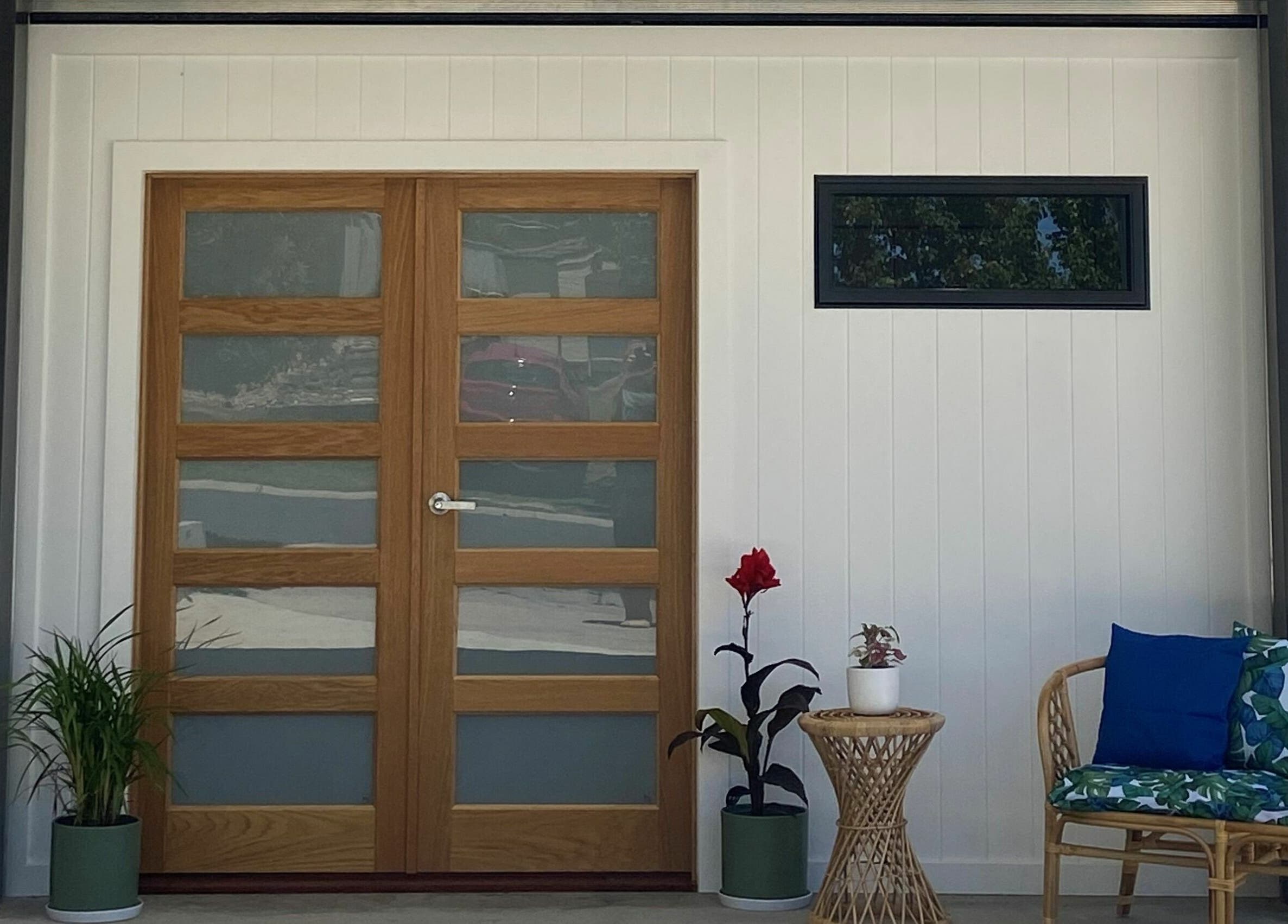 Entrance of The Massage Shed in Wodonga, Victoria, AU with a cozy seating area and plants.