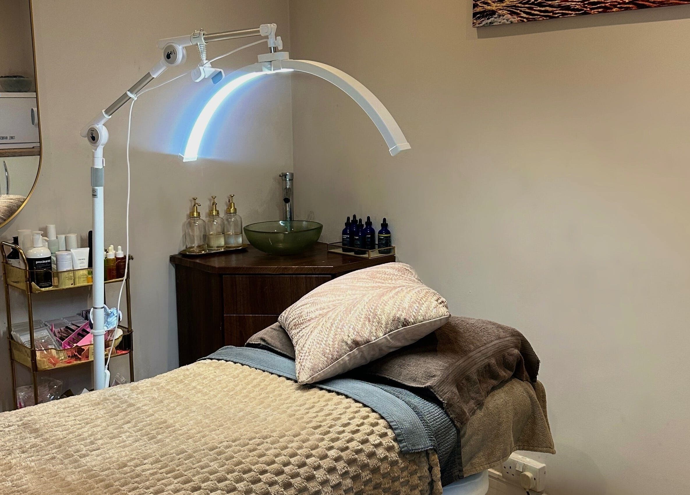 Cozy treatment bed setup at The Beauty Lounge Elmfield, South Croydon, England, GB, with elegant decor.