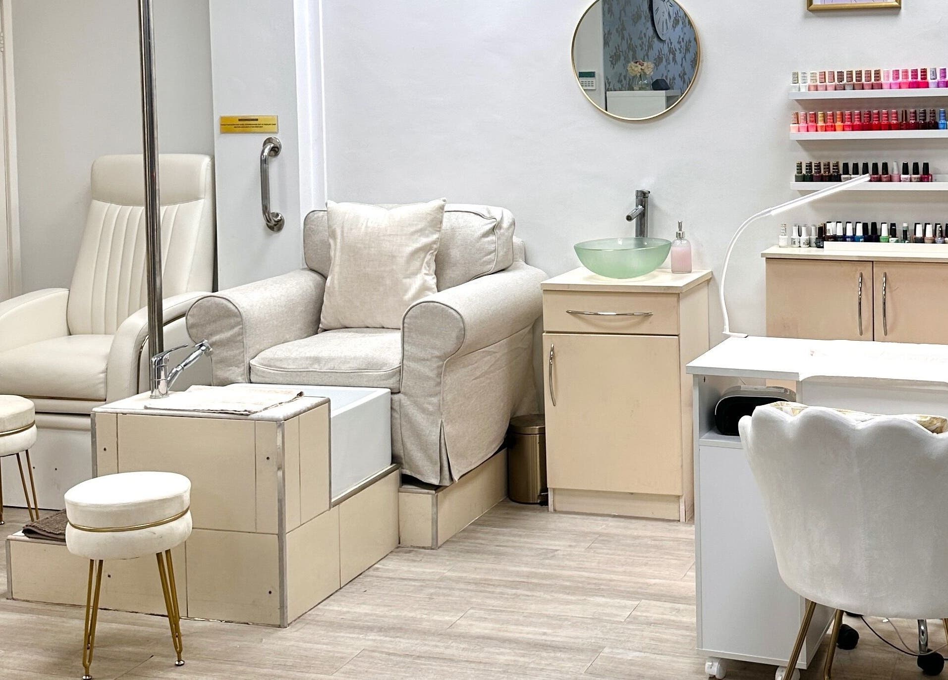 Nail care station at The Beauty Lounge Elmfield in South Croydon, England, GB, featuring elegant seating and polish display.
