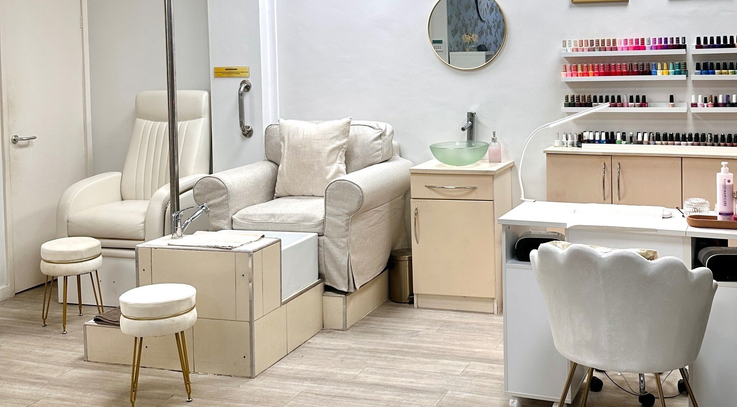 Nail care station at The Beauty Lounge Elmfield in South Croydon, England, GB, featuring elegant seating and polish display.