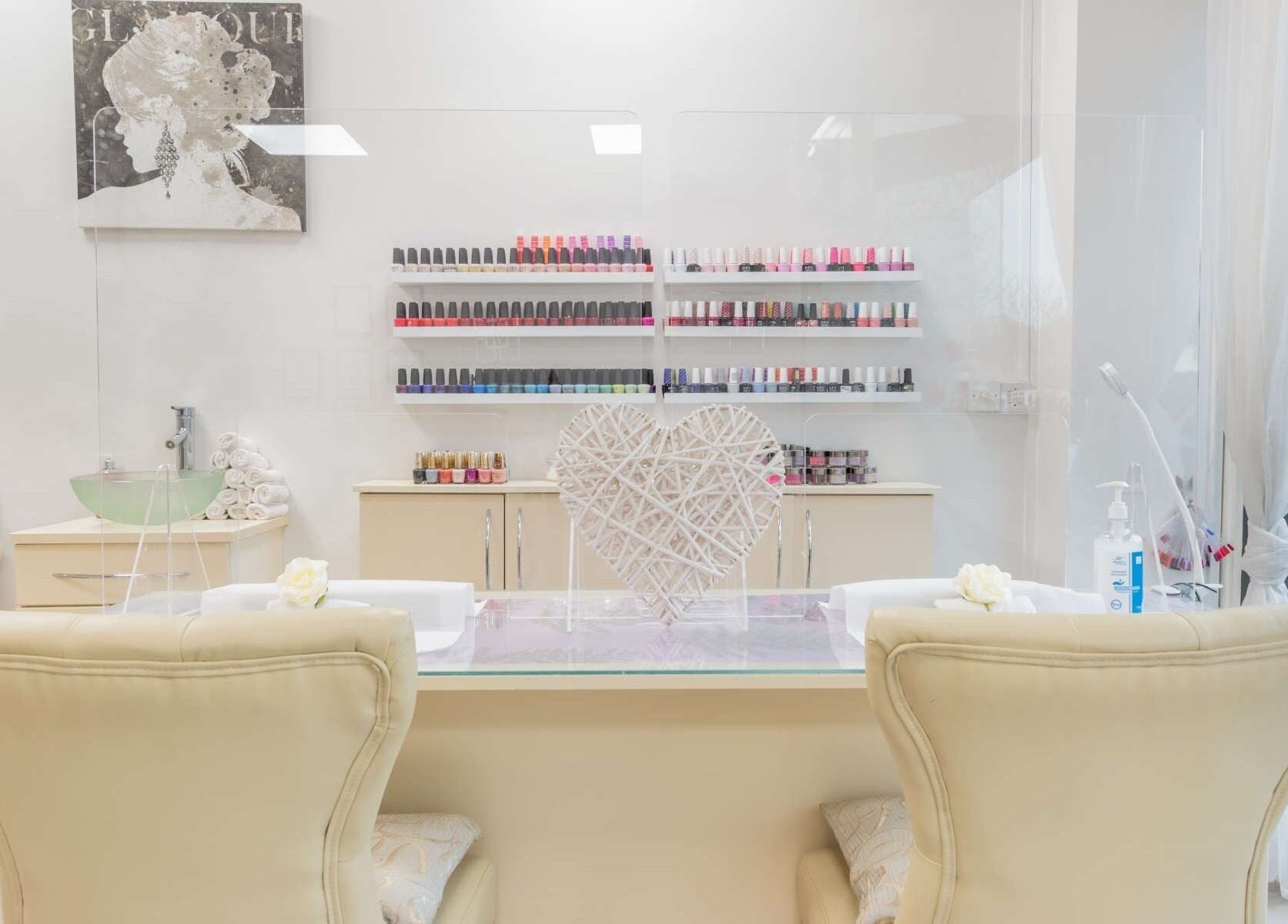 Elegant nail station at The Beauty Lounge Elmfield, South Croydon, England, GB with polish displays and cozy seating.