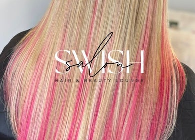 Blonde hair with pink highlights at Swish Salon Hair And Beauty Lounge, Charfield, Wotton-Under-Edge, England, GB.