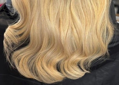 Elegant blonde waves styled at Swish Salon Hair And Beauty Lounge, Charfield, Wotton-Under-Edge, England, GB.