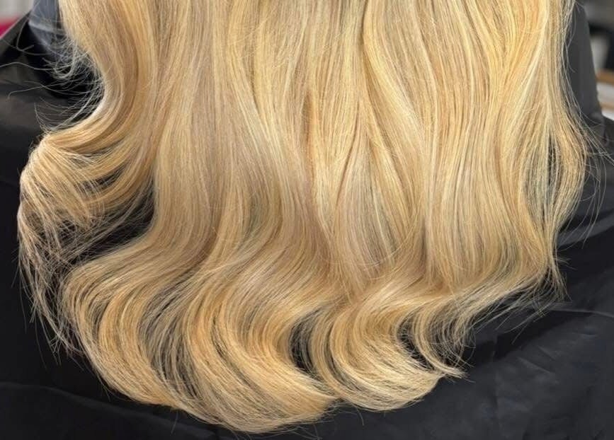 Elegant blonde waves styled at Swish Salon Hair And Beauty Lounge, Charfield, Wotton-Under-Edge, England, GB.