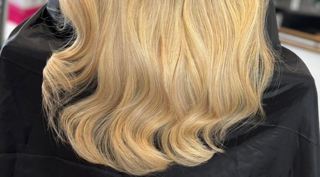 Elegant blonde waves styled at Swish Salon Hair And Beauty Lounge, Charfield, Wotton-Under-Edge, England, GB.