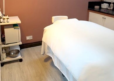 Relaxing therapy room at Sam at The Therapy Room, Ruislip, England, GB with a cozy massage bed.