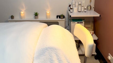 Peaceful therapy setting at Sam at The Therapy Room in Ruislip, England, GB, with warm lighting and wellness products.