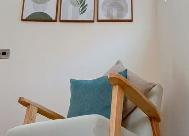 Comfortable chair in Renew Massage Therapies, Ottery Saint Mary, England, GB enhancing relaxation atmosphere.