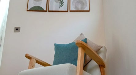 Comfortable chair in Renew Massage Therapies, Ottery Saint Mary, England, GB enhancing relaxation atmosphere.