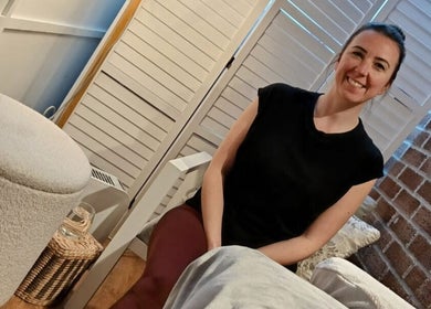 Therapist at Renew Massage Therapies in Ottery Saint Mary, England, providing a calming massage experience.