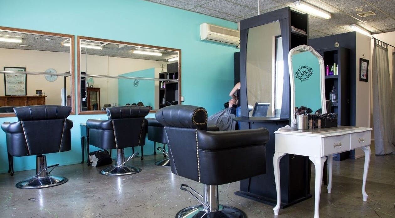 Interior of Sweet Lime Hair & Beauty, Paradise, South Australia, AU with chic black chairs and sleek mirrors.
