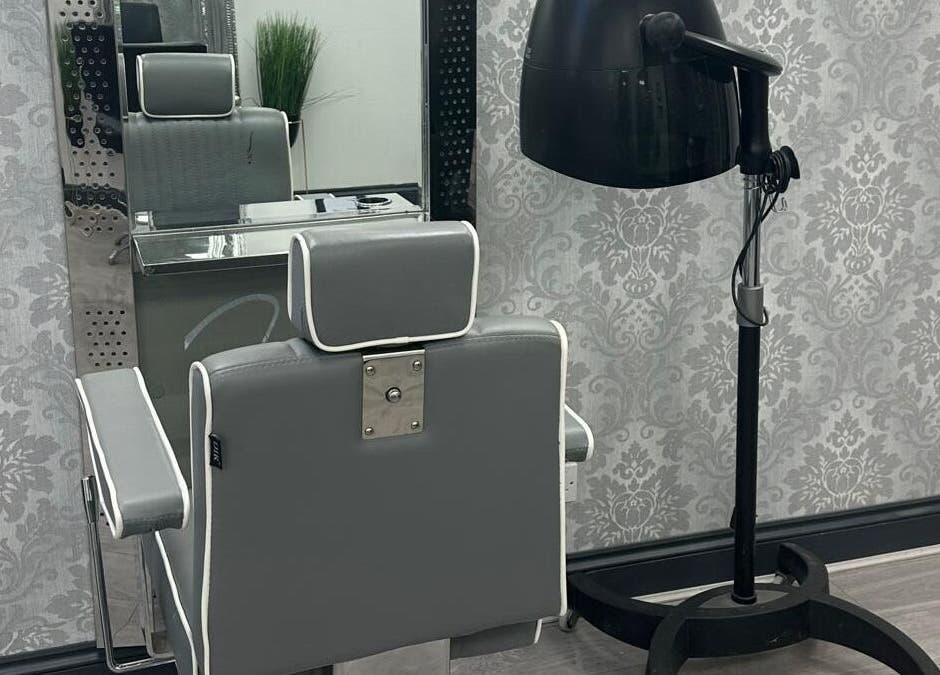 Modern salon chair and dryer setup at All in One Worcester, Worcester, England, GB.