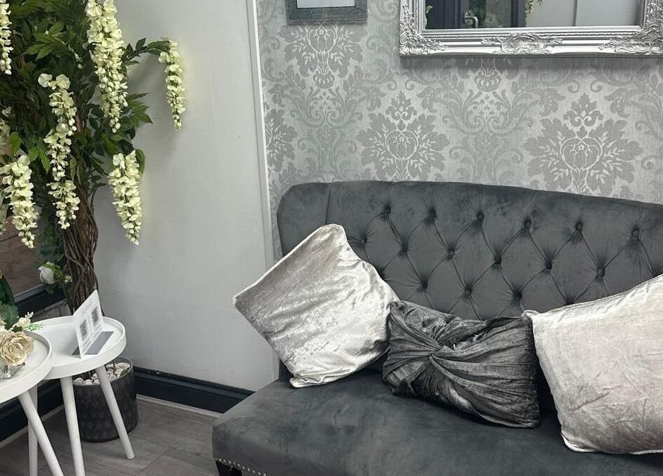 Elegant seating area at All in One Worcester, Worcester, England, GB with plush sofa and decor.