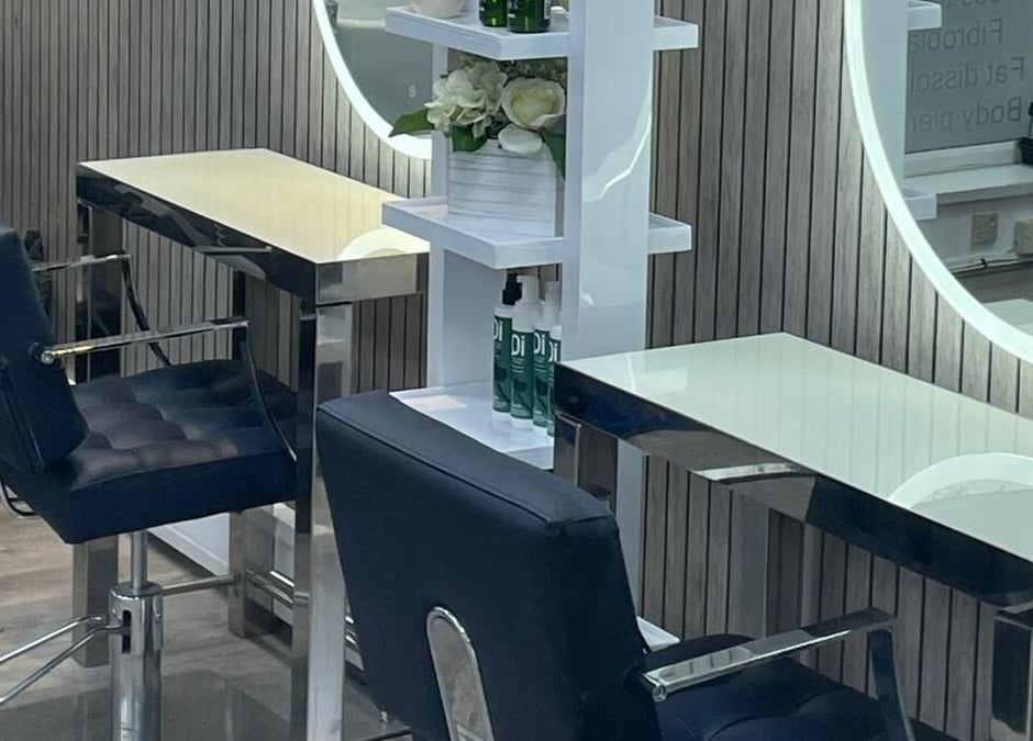 Chic beauty stations at All in One (Droitwich) in Droitwich Spa, England, GB with stylish chairs and mirrors.