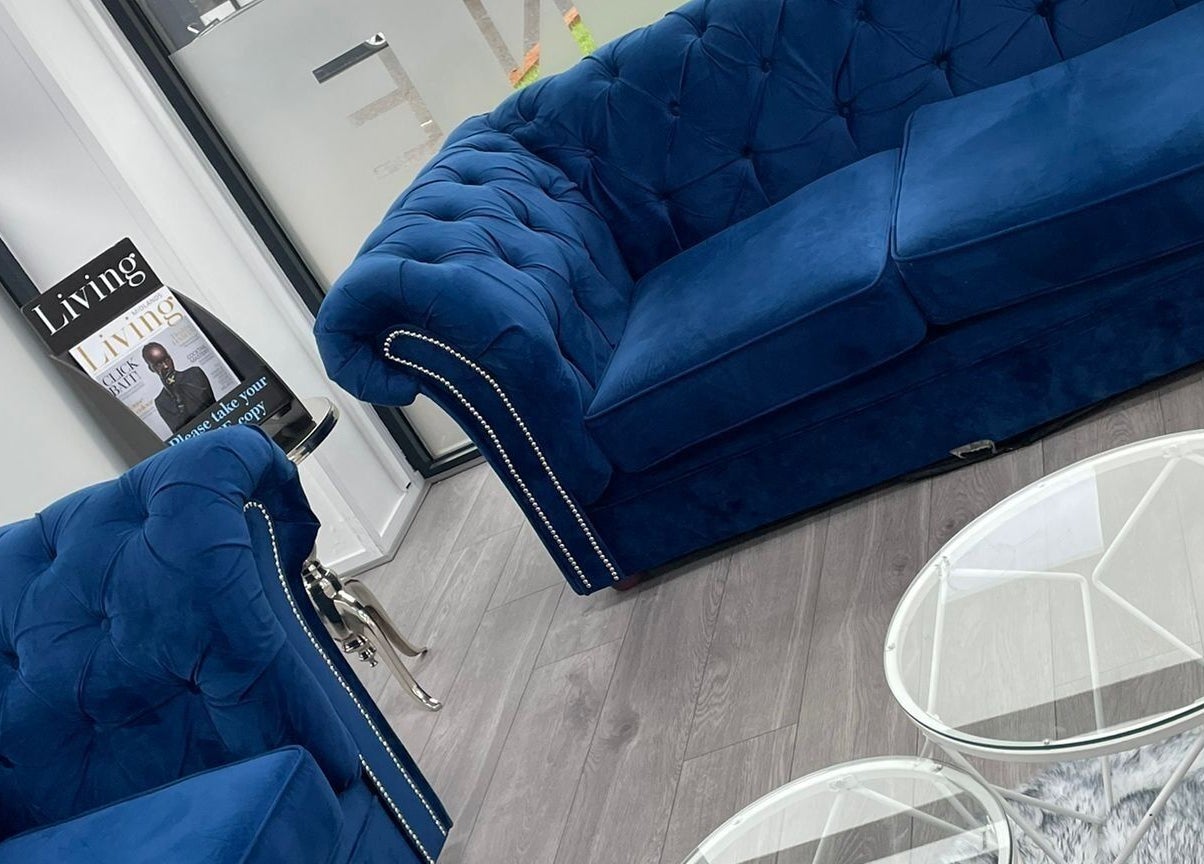 Elegant blue velvet couch in All in One (Droitwich) foyer, Droitwich Spa, England, GB.