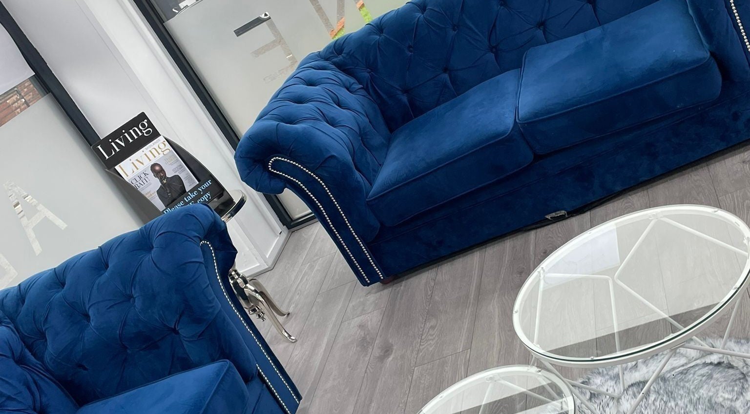 Elegant blue velvet couch in All in One (Droitwich) foyer, Droitwich Spa, England, GB.