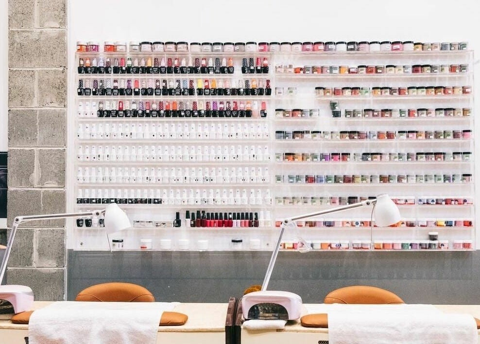 Nail polish wall at Tips and Toes - Fitzroy, Melbourne, Victoria, AU, showcasing vibrant color options.