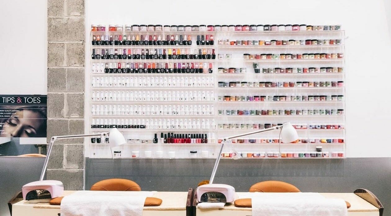 Nail polish wall at Tips and Toes - Fitzroy, Melbourne, Victoria, AU, showcasing vibrant color options.