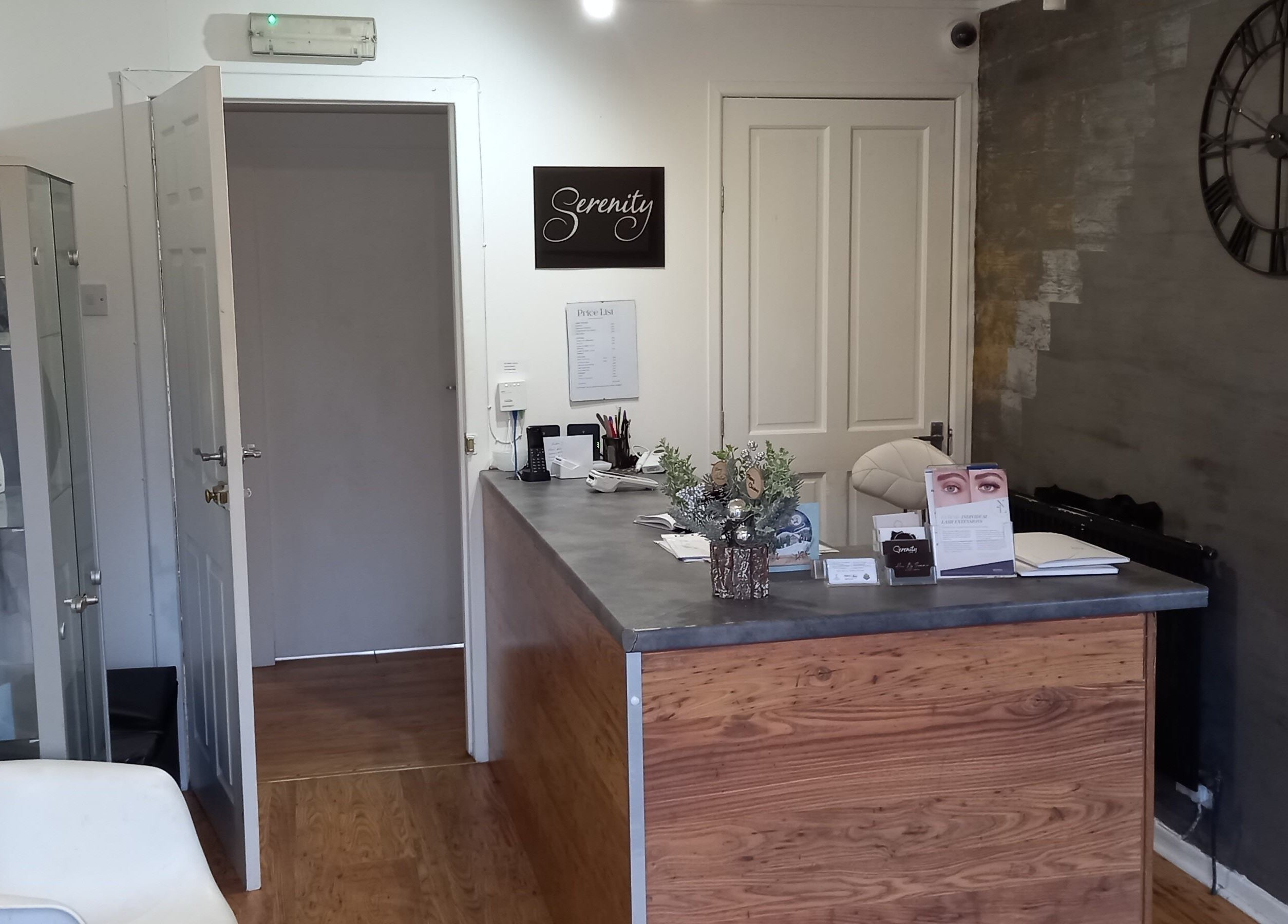 Reception area at Lothian Massage & Acupuncture, Tranent, Scotland, GB with a wooden desk and decor.