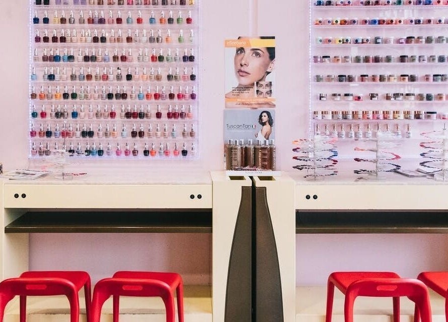 Nail polish display at Coco Nails, Melbourne, Victoria, AU showcases vibrant colors and organized beauty.