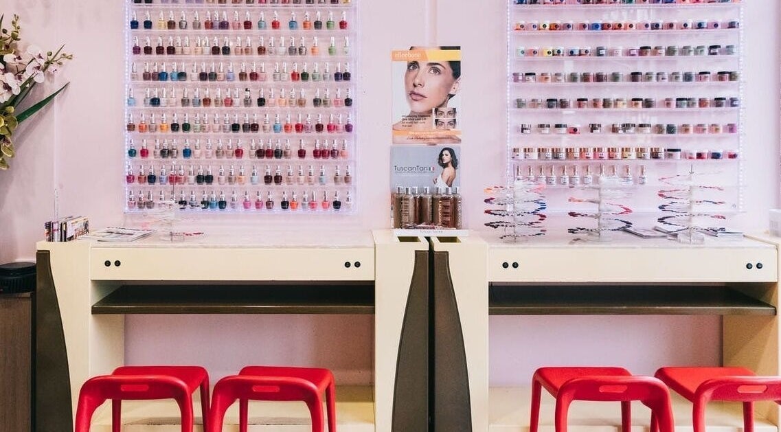 Nail polish display at Coco Nails, Melbourne, Victoria, AU showcases vibrant colors and organized beauty.