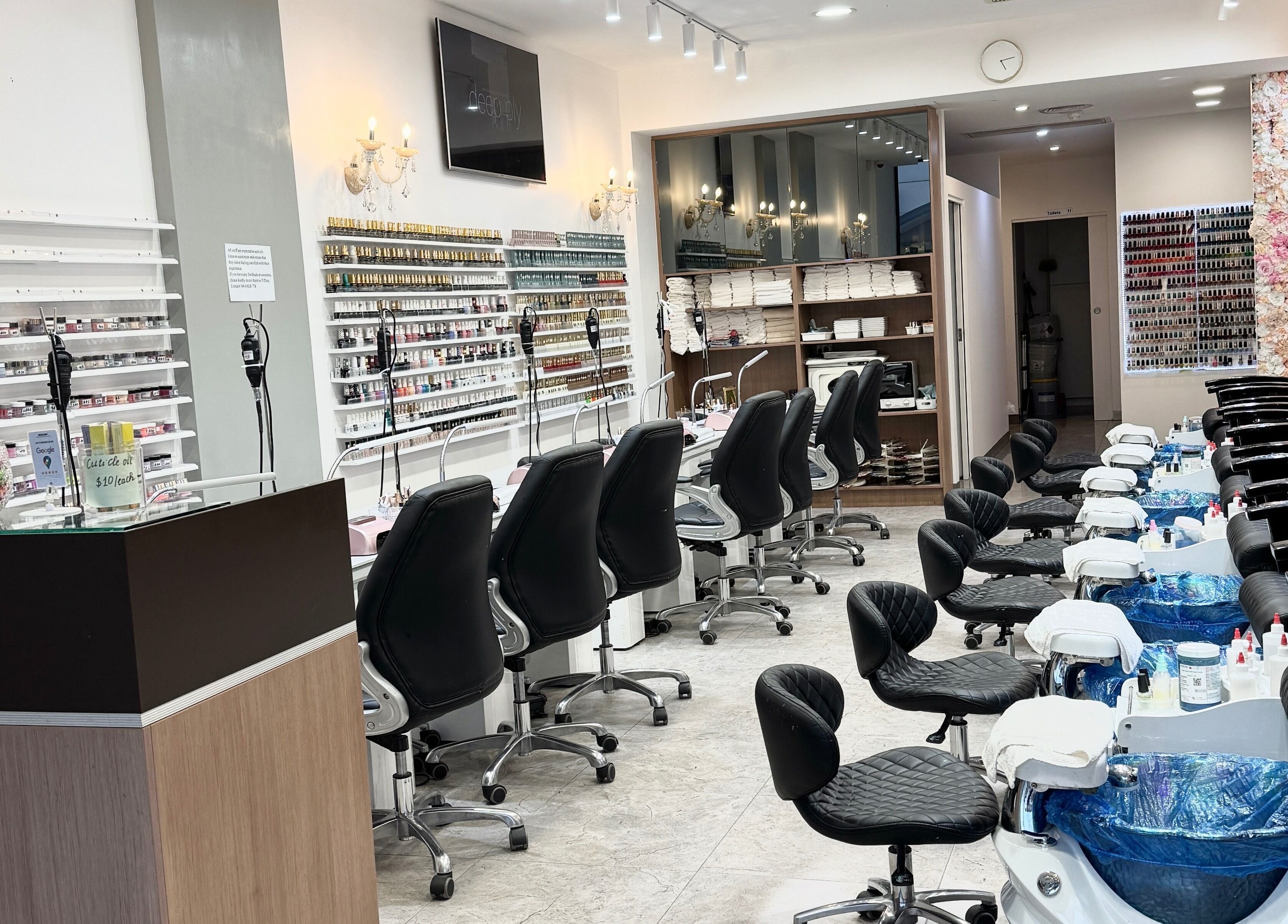 Modern nail salon interior at Coco Nails, Melbourne, Victoria, AU showcases elegant manicure stations.