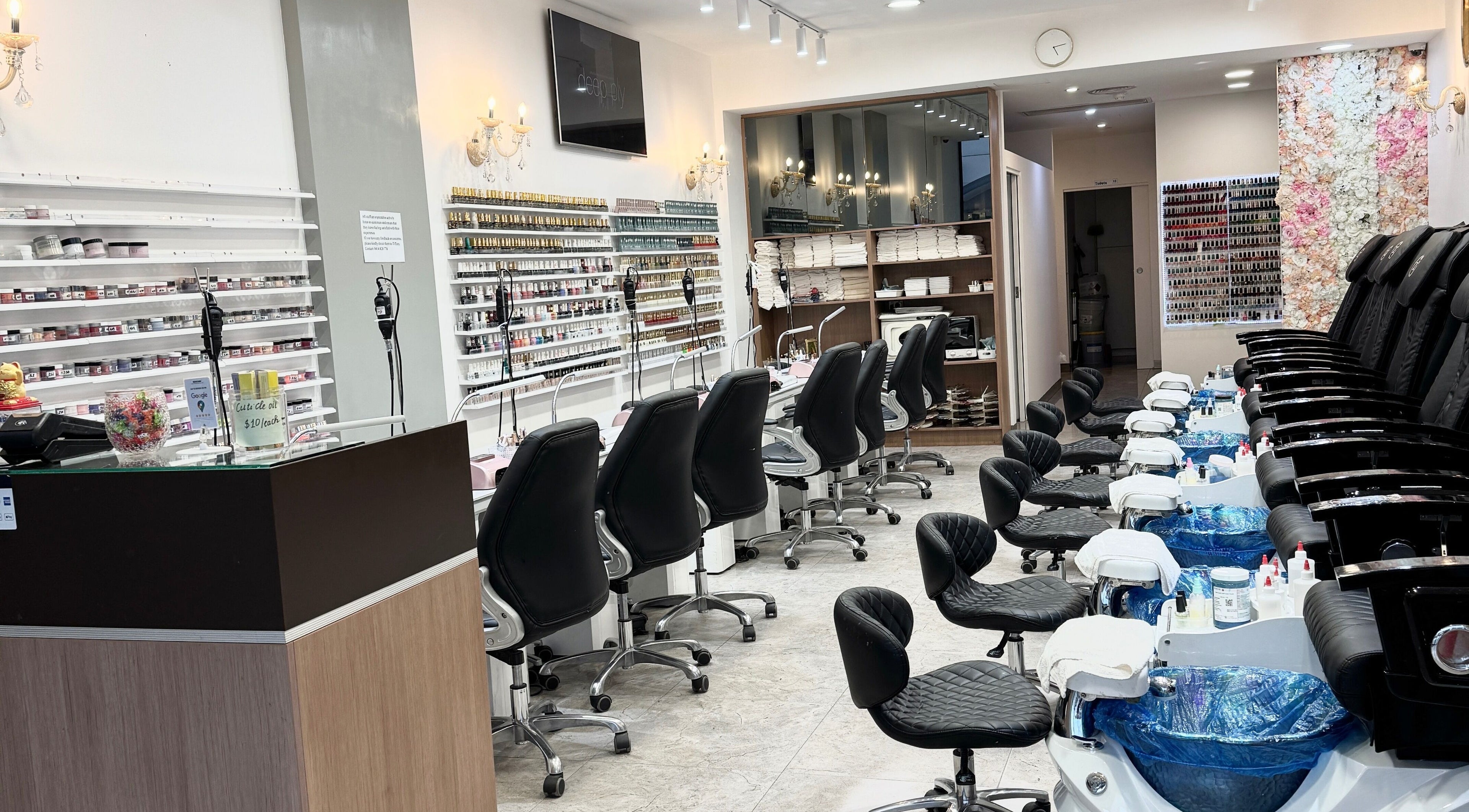 Modern nail salon interior at Coco Nails, Melbourne, Victoria, AU showcases elegant manicure stations.