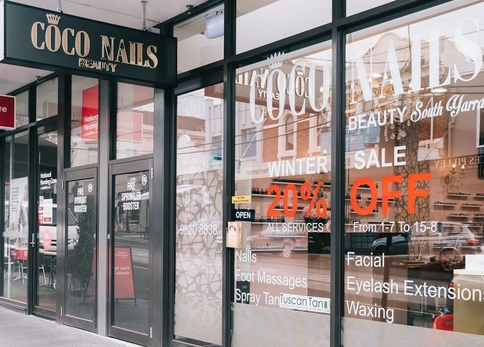 Exterior view of Coco Nails in Melbourne, Victoria, AU showcasing its storefront and promotional signage.
