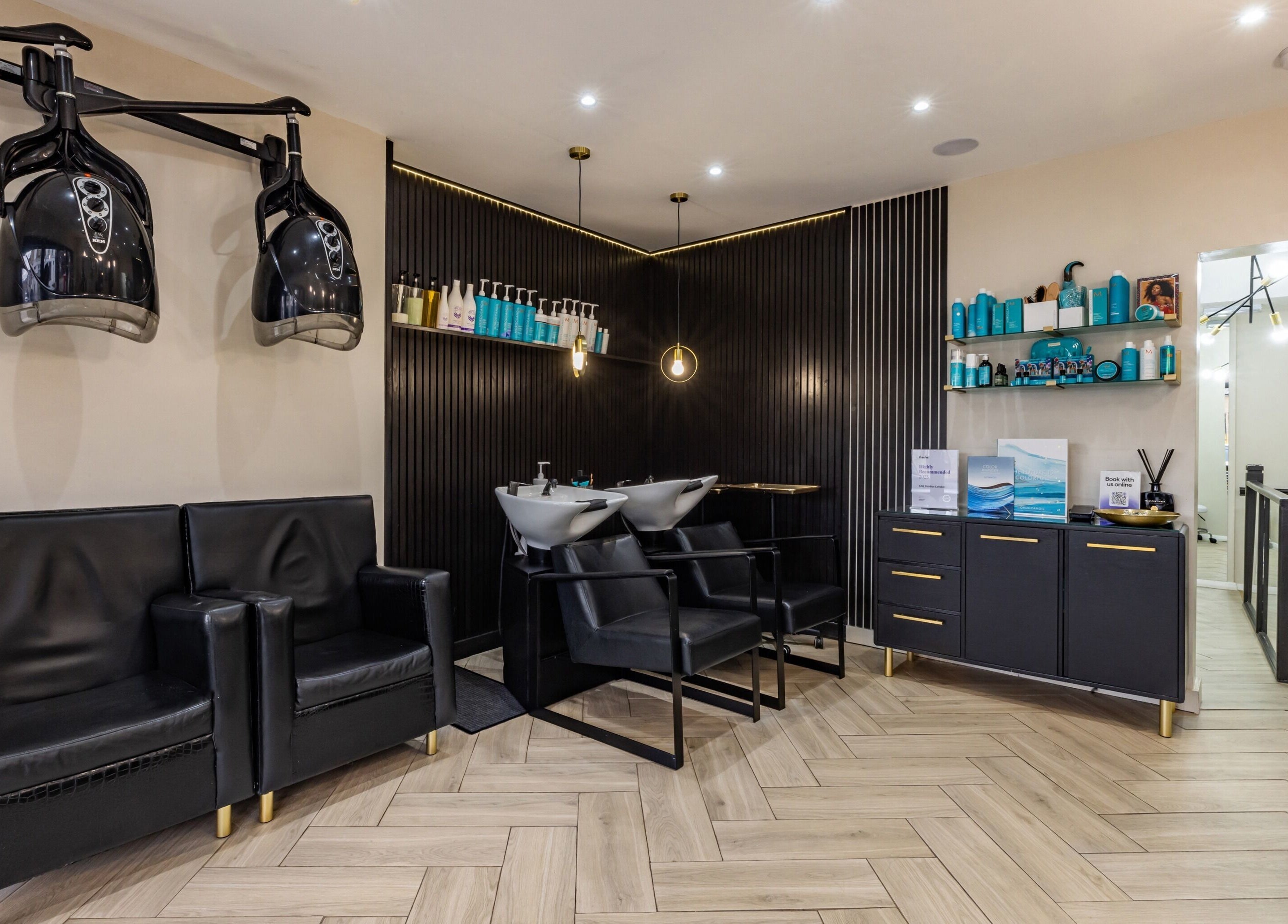 Sophisticated salon interior with modern chairs at ATH Studios, Croydon, England, GB.